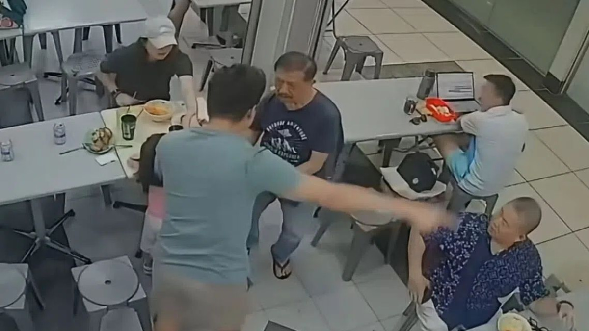 Singapore police investigate incident after elderly man pushed to ground for patting girl's head at coffee shop
