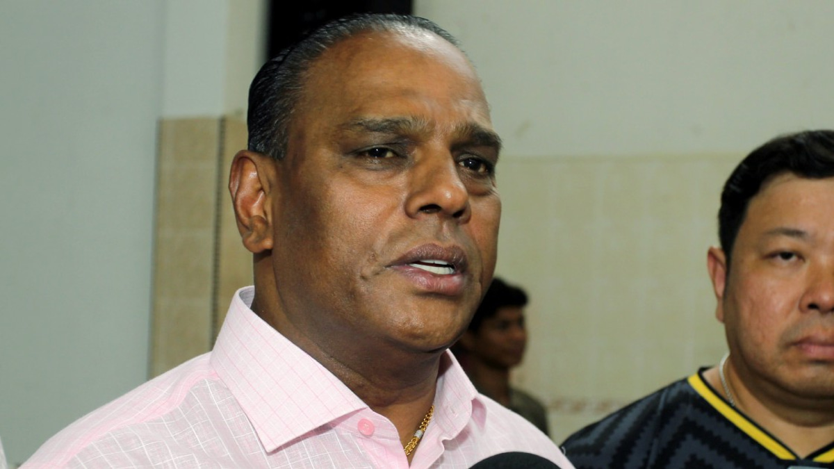 Black-clad supporters rally as ex-HR minister Saravanan faces corruption charges