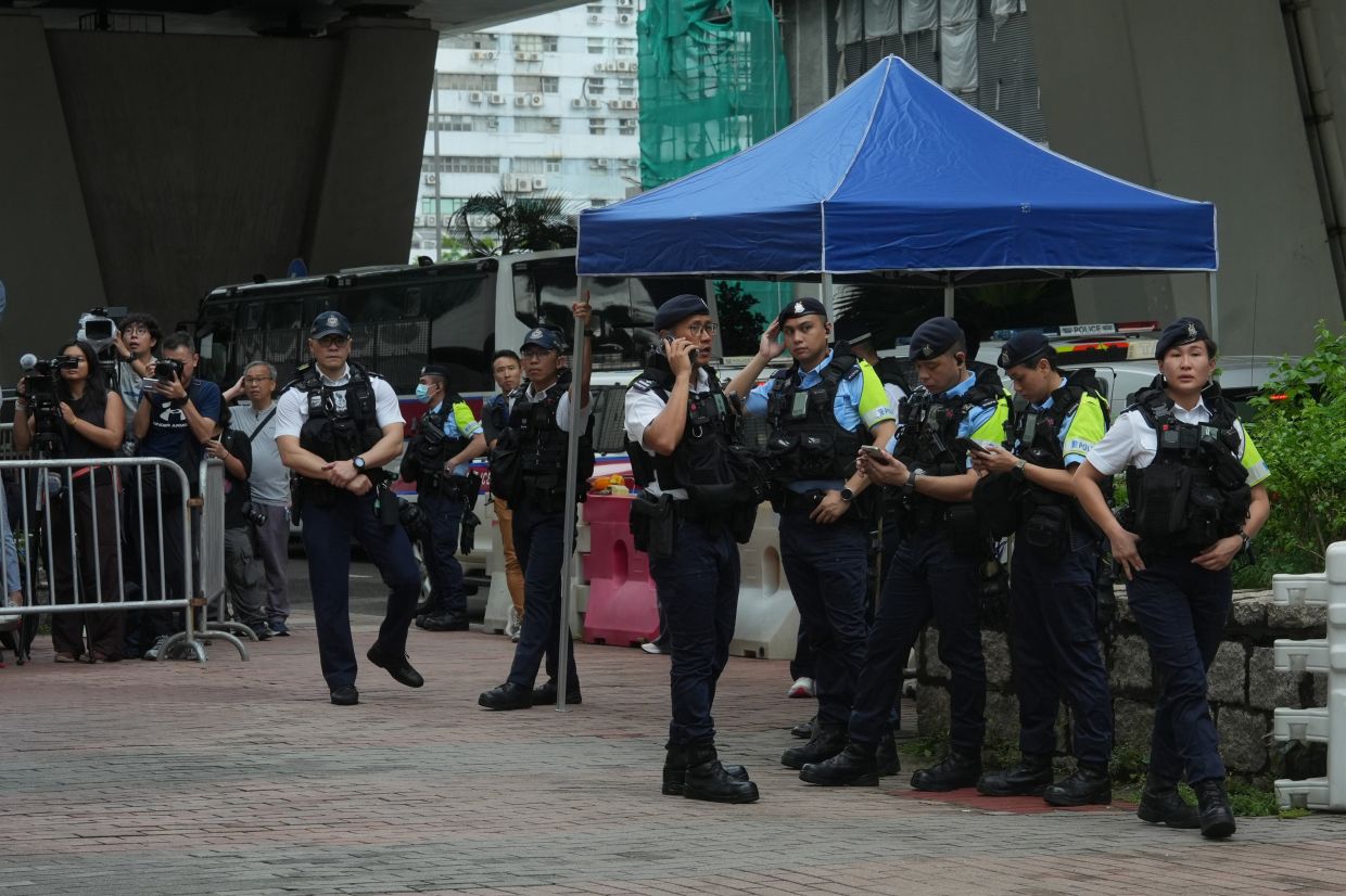 Hong Kong Woman Detained Over T-Shirt as Courts Crack Down on Dissent