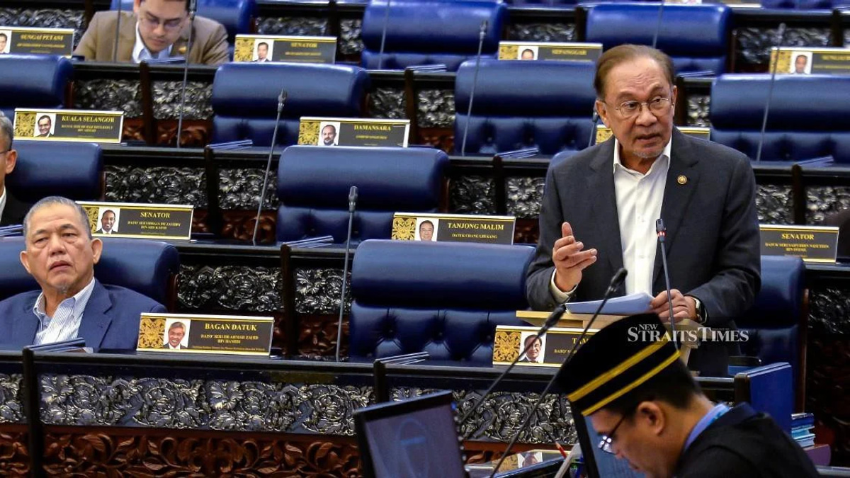 E-wallet operators must compensate scam victims if security safeguards fail, Anwar says