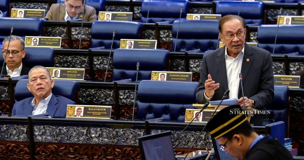 E-wallet operators must compensate scam victims if security safeguards fail, Anwar says