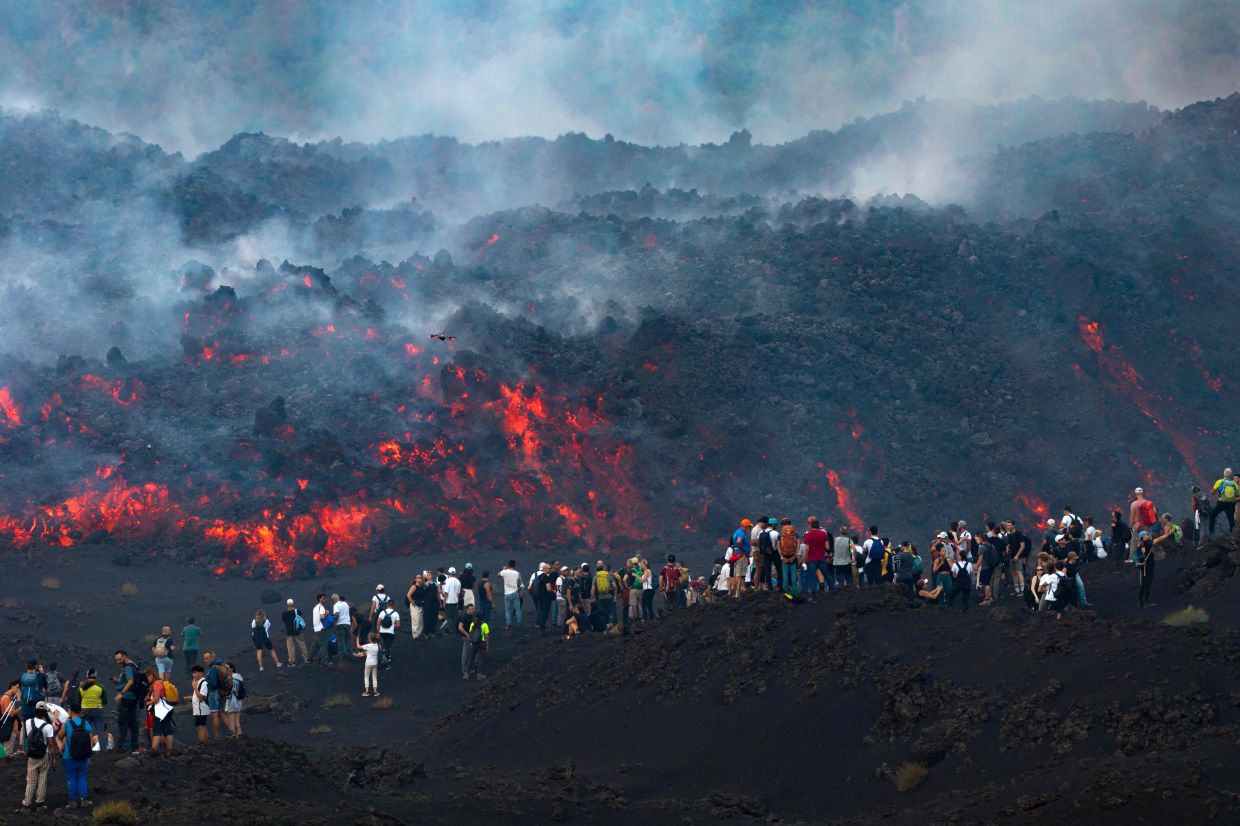 Mount Etna's dramatic eruption draws crowds of thrill-seeking tourists despite safety risks