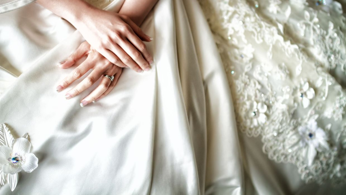 The Emotional Weight of Letting Go: Why Wedding Dresses Hold Such Power Over Us