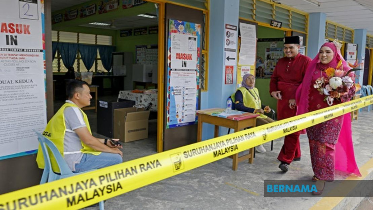 Young Bride Casts Vote in Traditional Wedding Garb at Negeri Sembilan Election