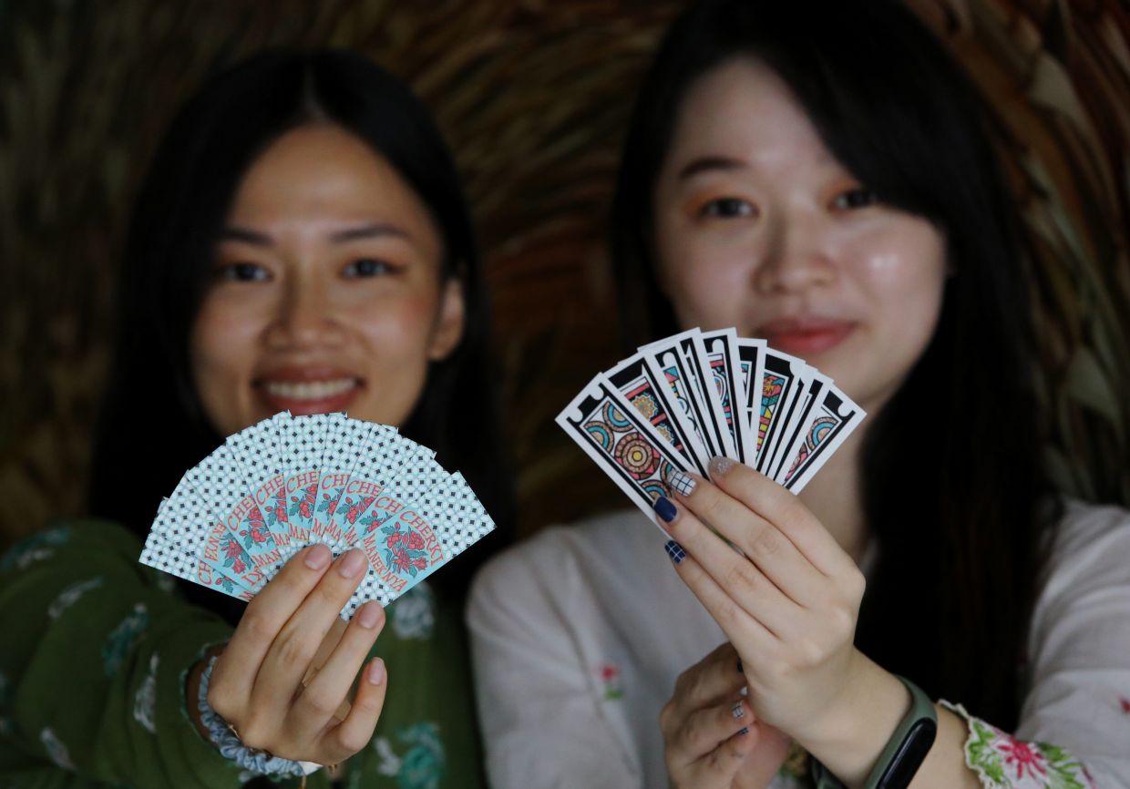 Sisters revive traditional Cherki card game with vibrant modern design to reconnect younger Peranakans with heritage